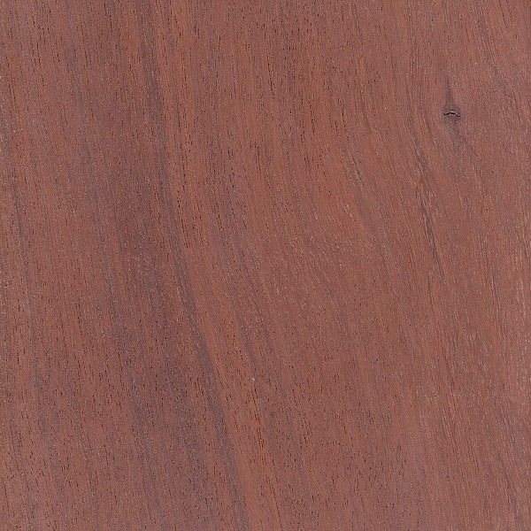 Close-up of reddish-brown hardwood with fine, linear grain